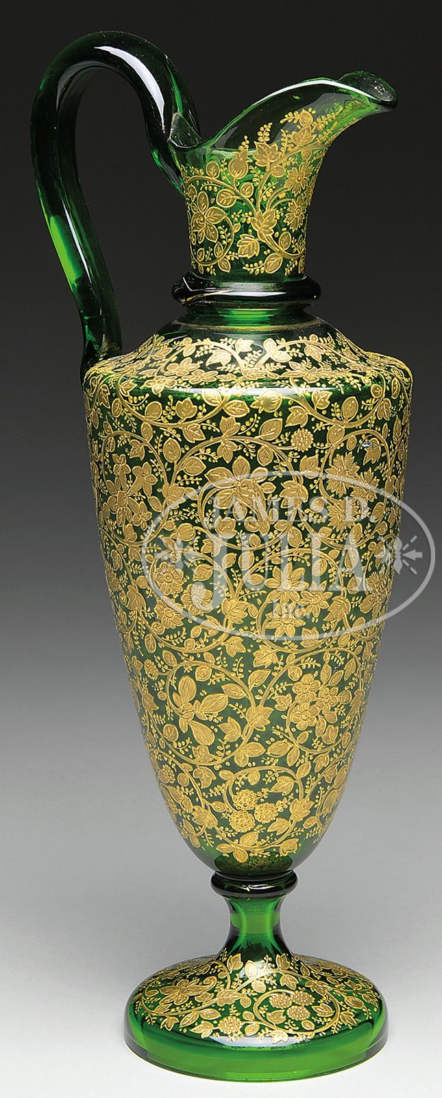 MOSER DECORATED EWER. Moser green glass ewer has dense gold enamel floral decora...