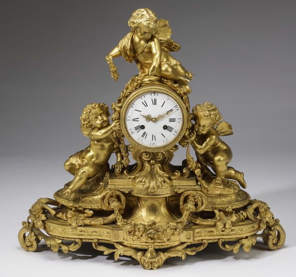 Italian dore' bronze figural mantal clock, early 20th century, having three cher...