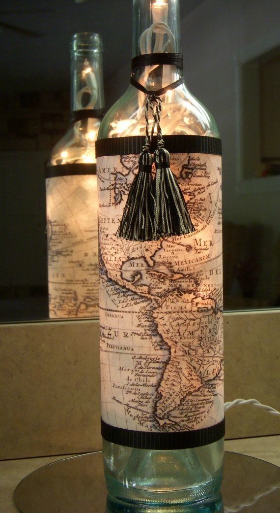 Upcycle a wine bottle by wrapping it with a map and turning it into a lamp.