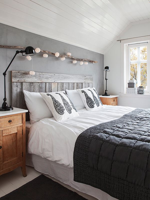 Bedroom with a touch of the outdoors: A rustic branch for decoration and for han...