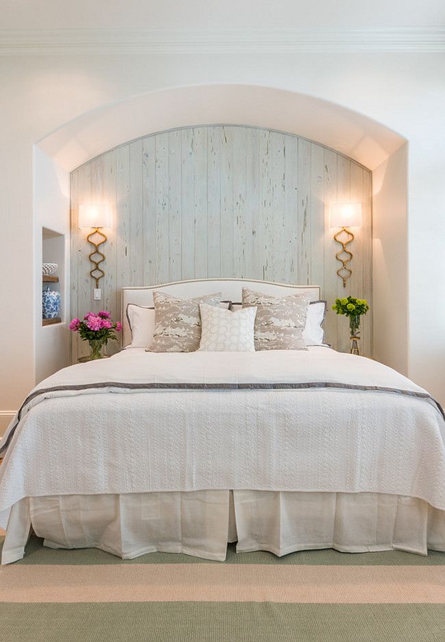 Gorgeous guest bedroom with pale blue cypress wall and gold sconces. Wall sconce...