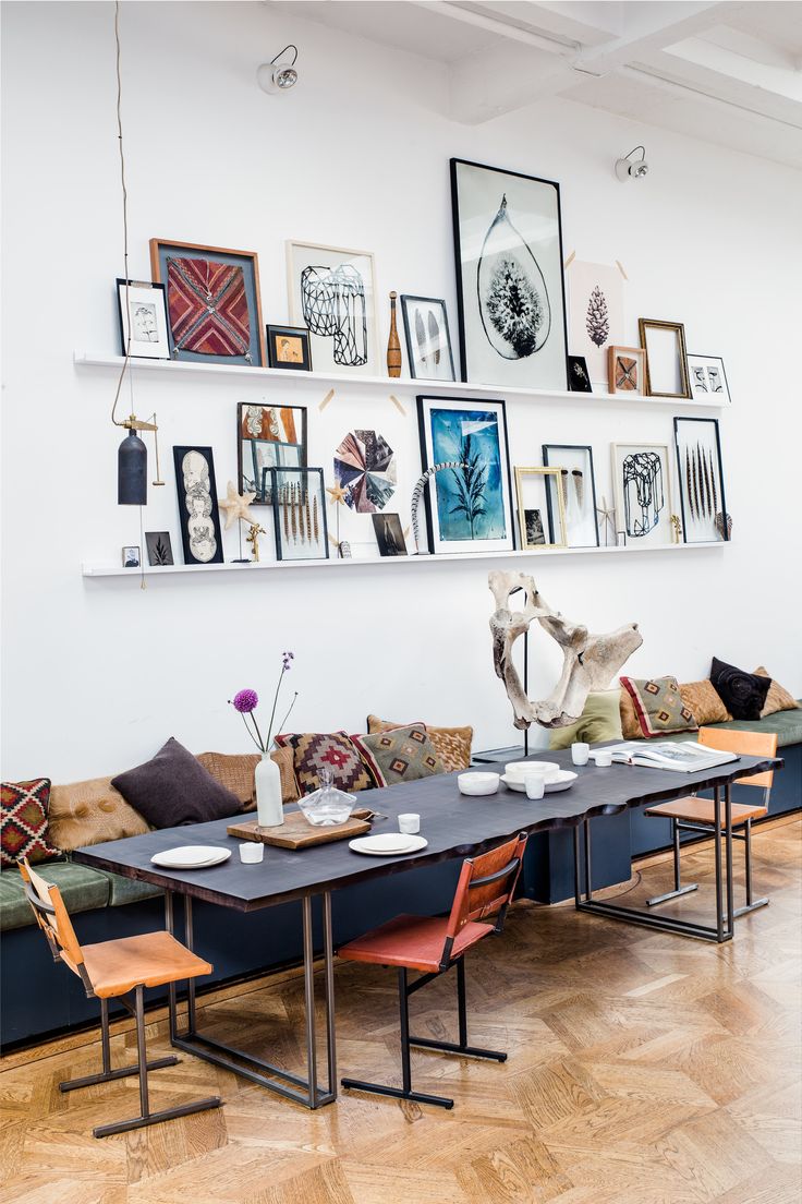 THE LOFT Amsterdam. Gallery wall on ledges, mixed chairs and kelim cushions. Nic...
