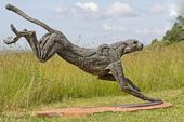 'Big Landing Cheetah (life size Bounding Big Cat statue)' by Jan Sweeney