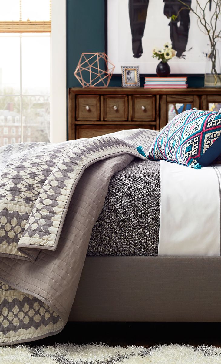 Add a pop of pattern to your master suite or guest room with this quilted cotton...