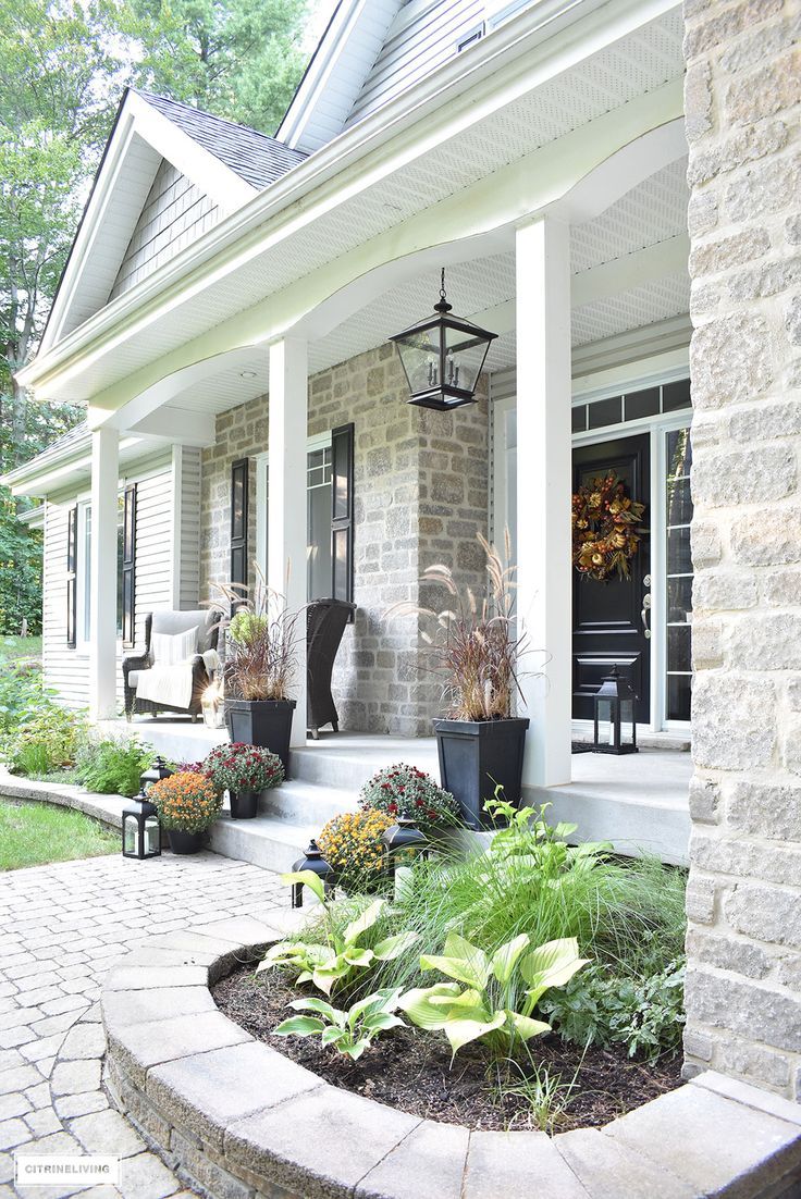 AN ELEGANT FRONT PORCH DECORATED FOR FALL